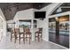 Inviting poolside bar with seating and stunning water views at 224 7Th E St, Tierra Verde, FL 33715