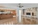 Inviting living room featuring a stone fireplace, built-in shelving, and an open layout at 4617 Westford Cir, Tampa, FL 33618