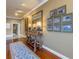 Spacious hallway with hardwood floors and lovely wall art at 5200 62Nd S Ave, St Petersburg, FL 33715