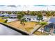 Aerial view of a single-Gathering home with a large backyard, pool, and canal access at 1009 Spindle Palm Way, Apollo Beach, FL 33572