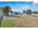 Large backyard with palm trees and canal view at 1009 Spindle Palm Way, Apollo Beach, FL 33572