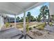 Relaxing front porch view overlooking the yard at 1009 Spindle Palm Way, Apollo Beach, FL 33572