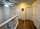 Upstairs hallway with doors to bedrooms and ample light at 12705 Longcrest Dr, Riverview, FL 33579