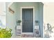 Charming home front door with a welcome mat, elegant decorations, and tasteful accents at 30399 Marquette Ave, Wesley Chapel, FL 33545