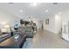 Inviting living room with hardwood floors, modern furniture, and plenty of natural light at 30399 Marquette Ave, Wesley Chapel, FL 33545