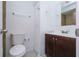 Clean bathroom with dark vanity, tiled floors, and a large mirror at 4721 Grove Point Dr, Tampa, FL 33624