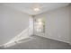 Well-lit bedroom featuring carpet flooring and a ceiling fan at 4721 Grove Point Dr, Tampa, FL 33624