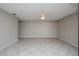 Large living room featuring neutral walls and tile floors at 4721 Grove Point Dr, Tampa, FL 33624