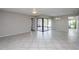 Spacious living area with sliding doors leading to a patio at 4721 Grove Point Dr, Tampa, FL 33624