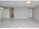 Bright living room with tile floors and neutral walls at 4721 Grove Point Dr, Tampa, FL 33624