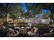 Backyard at night with firepit and seating area at 609 W Henry Ave, Tampa, FL 33604