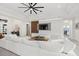 Bright living room, white sectional sofa, and marble wall at 9028 Ivy Stark Blvd, Wesley Chapel, FL 33545