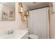 Clean bathroom with updated vanity and creative shelving at 9830 Mark Twain Ln, Port Richey, FL 34668