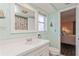 Bathroom with a white vanity, and a view into a bedroom at 9830 Mark Twain Ln, Port Richey, FL 34668