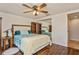 Cozy bedroom with a queen-size bed and built-in shelves at 9830 Mark Twain Ln, Port Richey, FL 34668