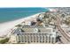 Aerial view of beachfront condo building and coastline at 12000 Gulf Blvd # 212-N, Treasure Island, FL 33706