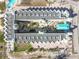 Aerial view of a resort complex with pool and courtyard at 12000 Gulf Blvd # 212-N, Treasure Island, FL 33706