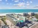 Aerial view of beachfront condo building and parking lot at 12000 Gulf Blvd # 212-N, Treasure Island, FL 33706