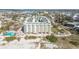 Aerial view of the condo building, pool, and beach access at 12000 Gulf Blvd # 212-N, Treasure Island, FL 33706