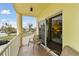 Spacious balcony with two chairs and a table at 12000 Gulf Blvd # 212-N, Treasure Island, FL 33706