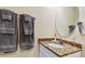 Bathroom with granite countertop and a large mirror at 12000 Gulf Blvd # 212-N, Treasure Island, FL 33706