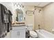 Clean bathroom with a tub, shower, and granite vanity at 12000 Gulf Blvd # 212-N, Treasure Island, FL 33706