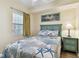 Bedroom with a full-size bed and coastal decor at 12000 Gulf Blvd # 212-N, Treasure Island, FL 33706