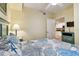 Bedroom with full-size bed and view of kitchen at 12000 Gulf Blvd # 212-N, Treasure Island, FL 33706