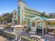 Beachfront building exterior with teal roof and signage at 12000 Gulf Blvd # 212-N, Treasure Island, FL 33706