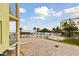 Community pool and patio area with beach access at 12000 Gulf Blvd # 212-N, Treasure Island, FL 33706