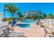 Relaxing pool area with lounge chairs and a hot tub at 12000 Gulf Blvd # 212-N, Treasure Island, FL 33706