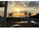 Stunning sunset view over the beach and resort pool area at 12000 Gulf Blvd # 212-N, Treasure Island, FL 33706