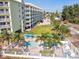 Aerial view of building and a resort-style pool at 12000 Gulf Blvd # 212-N, Treasure Island, FL 33706