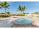 Small, relaxing pool with palm trees nearby at 12000 Gulf Blvd # 212-N, Treasure Island, FL 33706