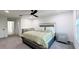 Spacious bedroom with a queen bed and en-suite bathroom at 19314 Eagle Creek Ln, Tampa, FL 33647