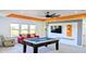 Fun game room with a pool table and comfortable seating at 19314 Eagle Creek Ln, Tampa, FL 33647