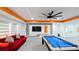 Modern game room with pool table and large TV at 19314 Eagle Creek Ln, Tampa, FL 33647