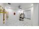 Serene prayer room with white walls, marble floors, and a small shrine at 19314 Eagle Creek Ln, Tampa, FL 33647