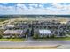 Aerial view of a shopping center with various retail stores and parking areas at 36522 Well Hill Way, Zephyrhills, FL 33541