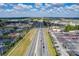 Aerial view of a highway and surrounding commercial areas at 36522 Well Hill Way, Zephyrhills, FL 33541