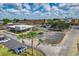 Aerial perspective of a shopping center featuring a dental office and parking spaces at 36522 Well Hill Way, Zephyrhills, FL 33541