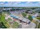 Aerial view of a gas station and surrounding businesses at 36522 Well Hill Way, Zephyrhills, FL 33541