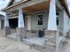 View of the home's front porch construction featuring brick pillars and a concrete slab at 413 Shannon Estates Ct, Plant City, FL 33563