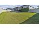 Large backyard with grassy lawn and privacy fence at 8321 Sky Eagle Dr, Tampa, FL 33635