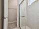 Modern bathroom with a walk-in shower and a closet at 8321 Sky Eagle Dr, Tampa, FL 33635