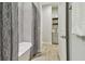 Bathroom with bathtub and shower, and a patterned curtain at 8321 Sky Eagle Dr, Tampa, FL 33635