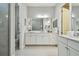 Elegant bathroom with double vanity, large mirror, and separate shower at 8321 Sky Eagle Dr, Tampa, FL 33635