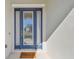 Blue front door with glass panels and a welcome mat at 8321 Sky Eagle Dr, Tampa, FL 33635