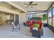 Relaxing screened patio with comfortable seating and view of backyard at 8321 Sky Eagle Dr, Tampa, FL 33635