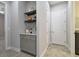 Built-in wet bar with shelving, wine rack, and cabinets at 8321 Sky Eagle Dr, Tampa, FL 33635